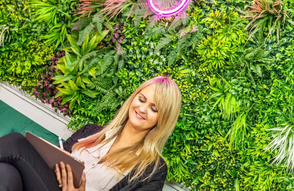 Co-Founder & Creative Director, Lynsey Edwards sat in the TRCREATIVE office, sketching on her iPad